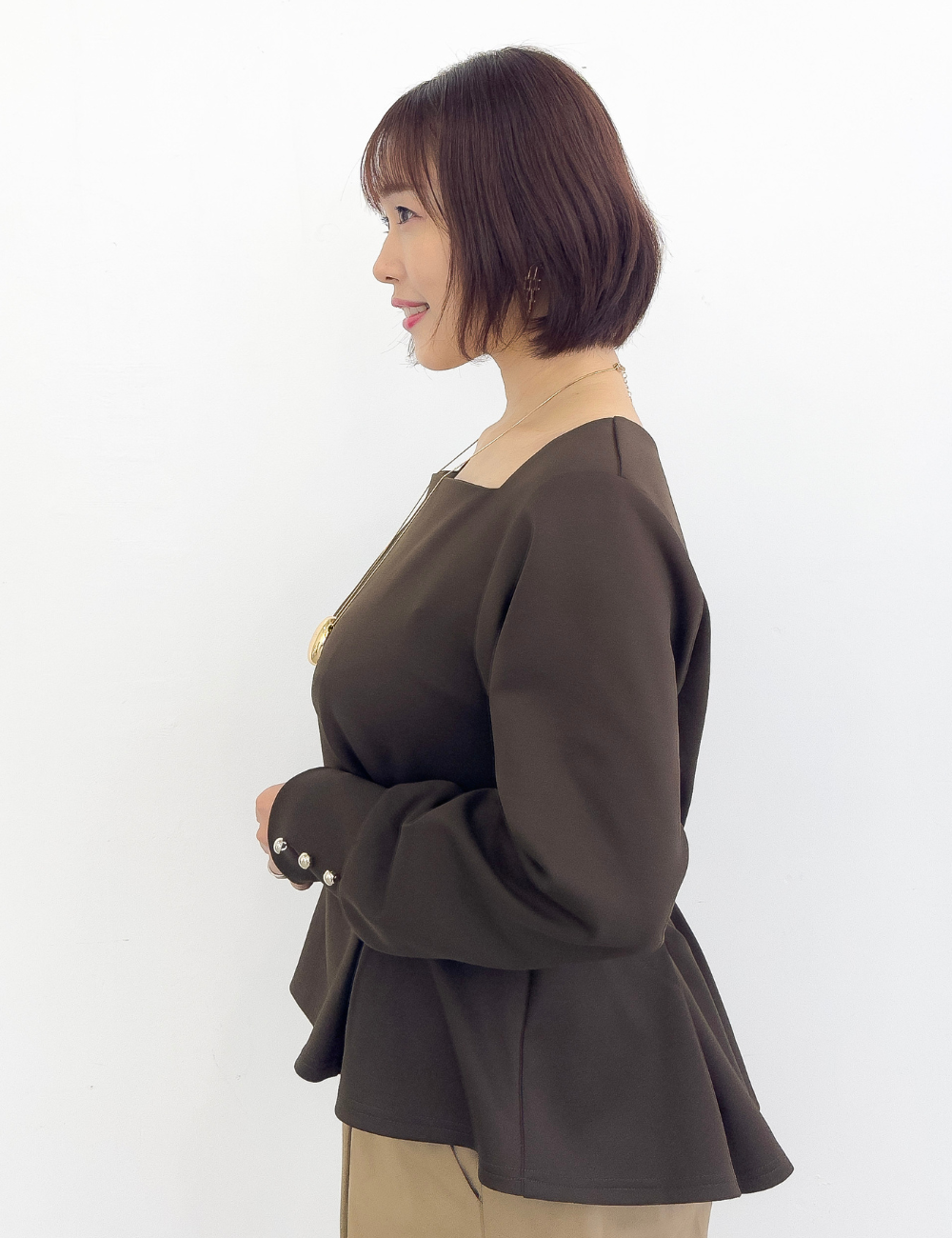 首延長ペプラムトップス